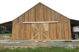 Siding choices like wood transform the look of Metal Barns.